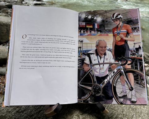 The printed book “Who is Opa?” by a river: Open at spread 8