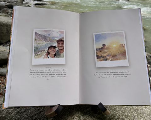 The printed book “Who is Opa?” by a river: Open at spread 10